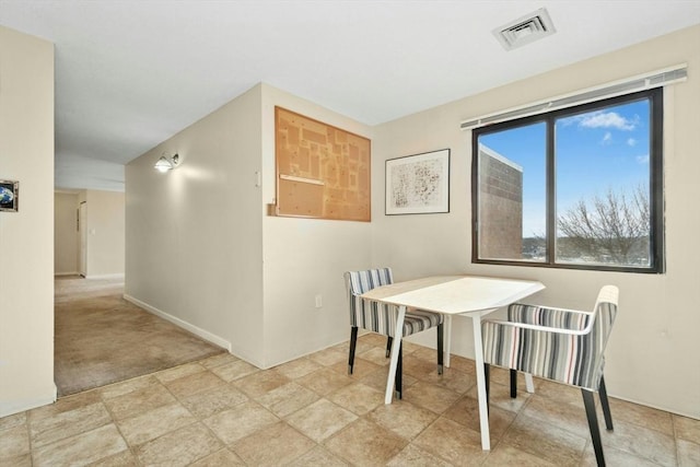 dining space featuring visible vents