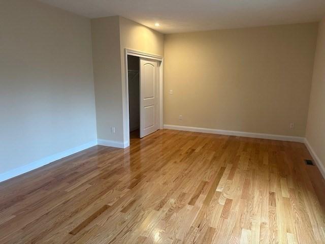 spare room with light hardwood / wood-style flooring