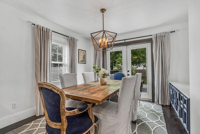 5 Vandergrift St, Lawrence, MA 01843 - dining space featuring healthy amount of natural light, french doors, dark wood finished floors, and a chandelier