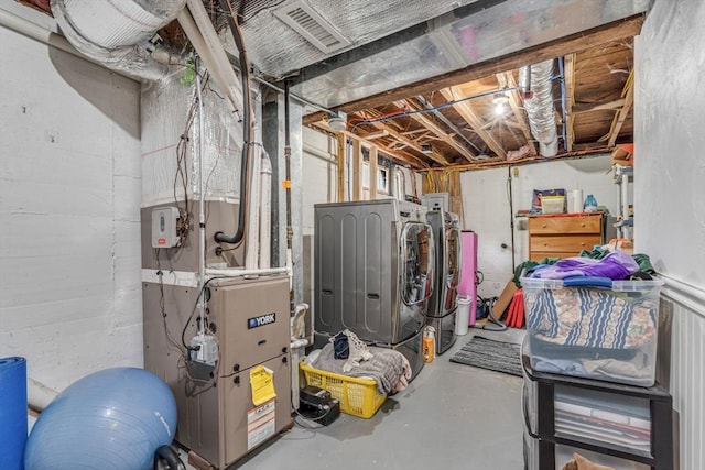 5 Vandergrift St, Lawrence, MA 01843 - unfinished basement featuring washing machine and dryer