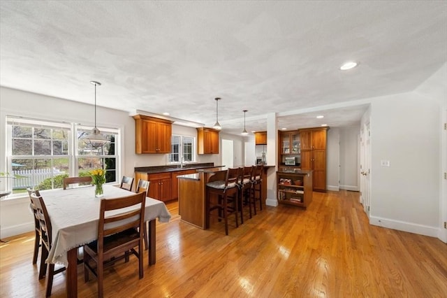 76 Union St, Natick, MA 01760 - dining area with a healthy amount of sunlight, baseboards, light wood-style floors, and recessed lighting