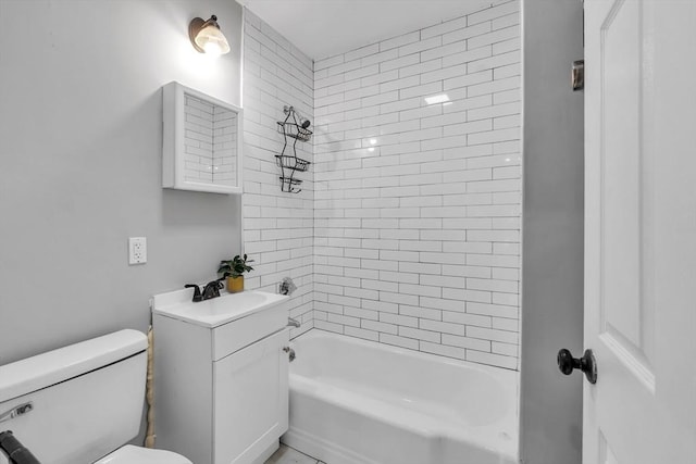 bathroom featuring toilet, tub / shower combination, and vanity
