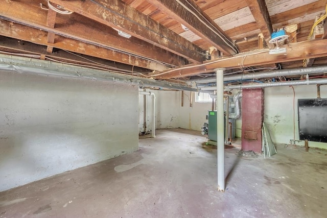 basement featuring oil tank and heating unit