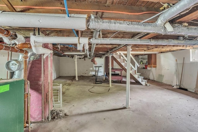 unfinished below grade area featuring stairway