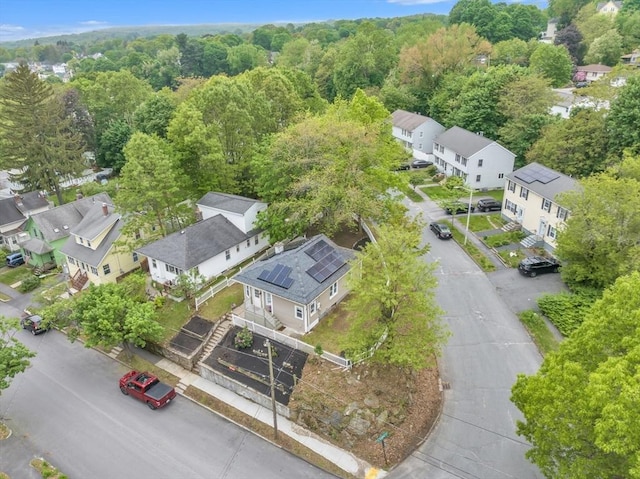 aerial perspective of suburban area featuring a forest