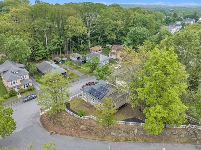 aerial view of residential area featuring a heavily wooded area