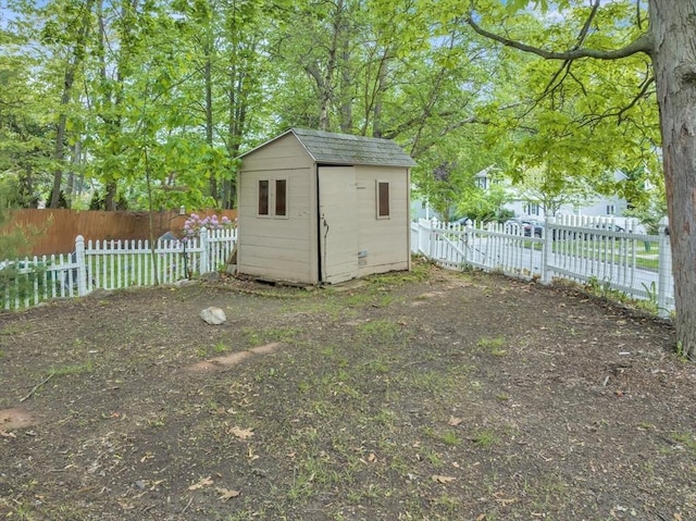 view of shed with a fenced backyard