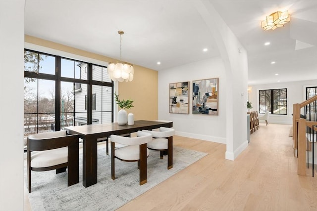 dining room featuring a chandelier and light hardwood / wood-style flooring