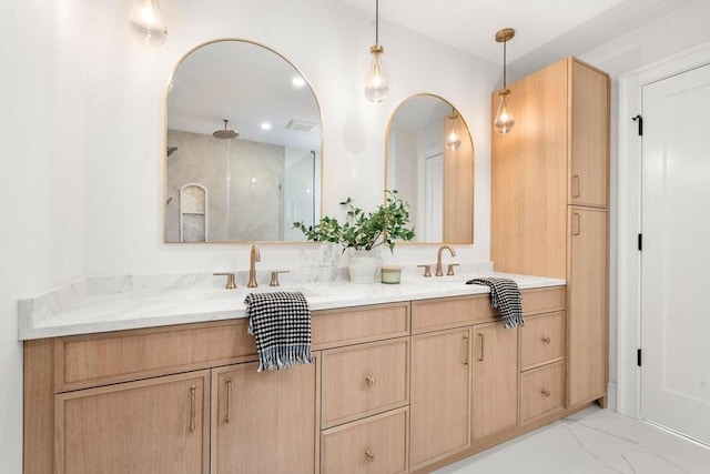 bathroom with walk in shower and vanity