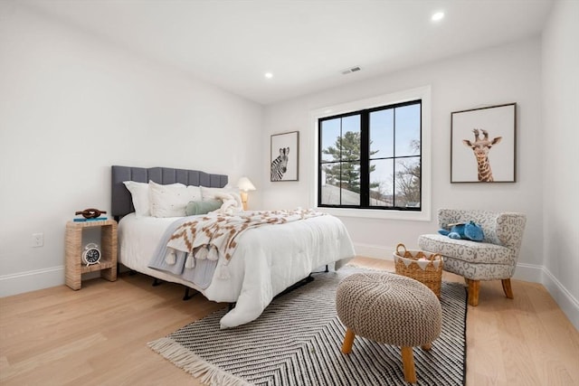 bedroom with light hardwood / wood-style flooring