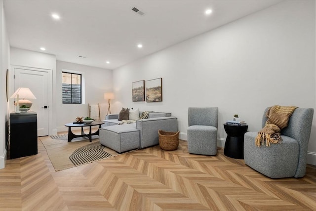 living room featuring light parquet flooring