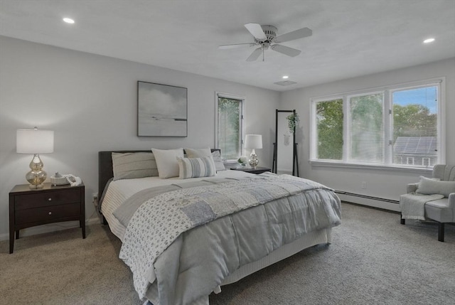 bedroom featuring a baseboard heating unit, carpet flooring, baseboards, recessed lighting, and ceiling fan