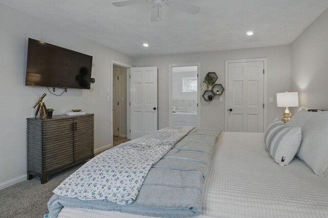 carpeted bedroom with baseboards, ensuite bath, recessed lighting, and a ceiling fan
