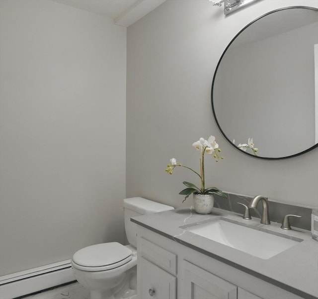 bathroom featuring a baseboard heating unit, toilet, vanity, and marble finish flooring
