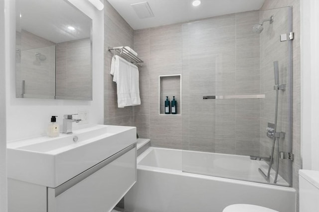 full bathroom featuring toilet, bathtub / shower combination, vanity, and recessed lighting