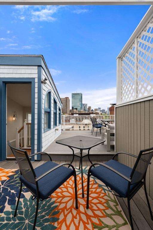view of patio / terrace featuring a city view