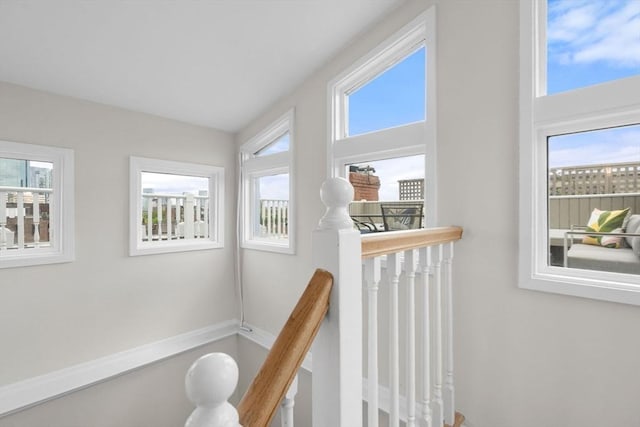 hallway featuring an upstairs landing