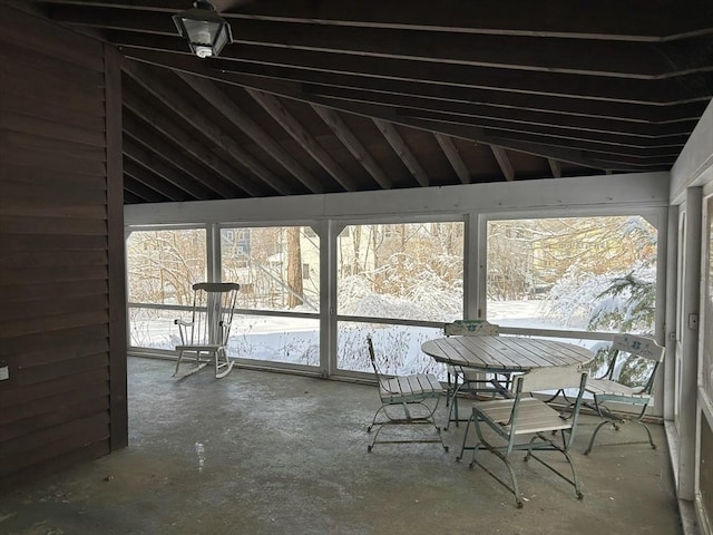 unfurnished sunroom with vaulted ceiling