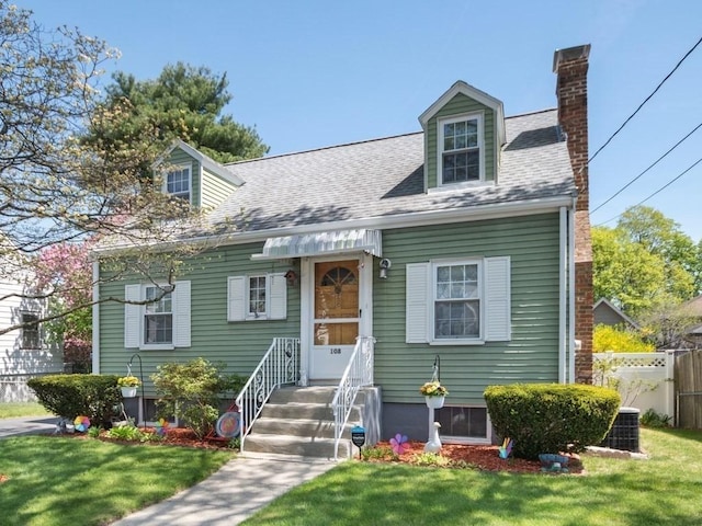 108 Edward Rd, Watertown, MA 02472 - new england style home with a chimney and a shingled roof