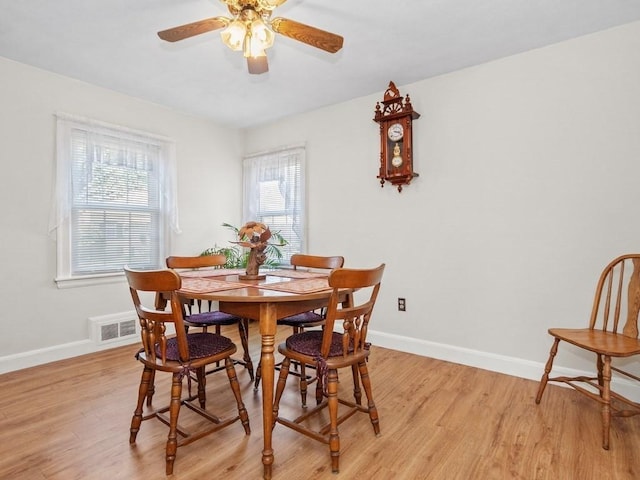 108 Edward Rd, Watertown, MA 02472 - dining space with baseboards, a ceiling fan, and light wood-style flooring