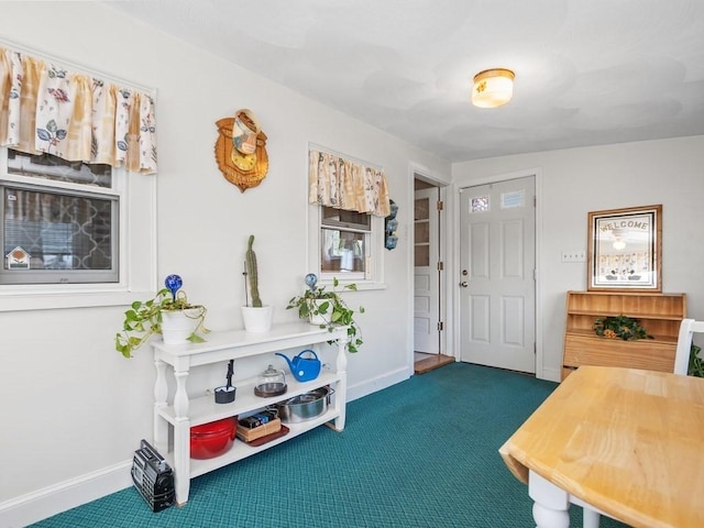 108 Edward Rd, Watertown, MA 02472 - foyer entrance with dark carpet and baseboards