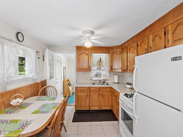 108 Edward Rd, Watertown, MA 02472 - kitchen featuring white appliances, light countertops, a ceiling fan, light tile patterned flooring, and backsplash