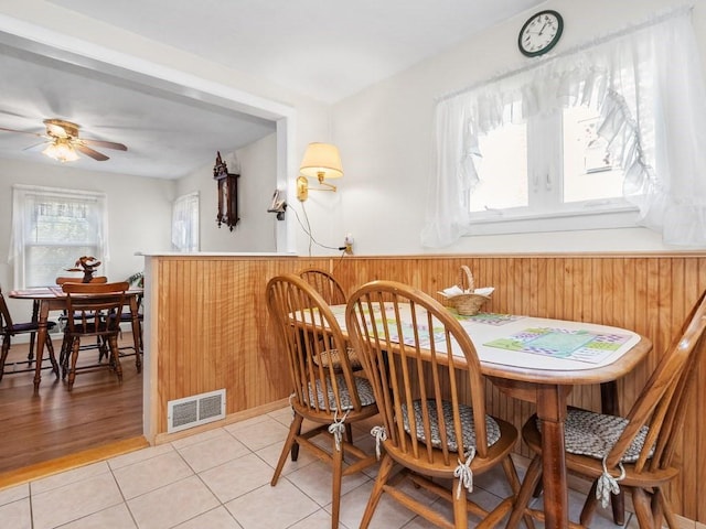 108 Edward Rd, Watertown, MA 02472 - dining room featuring a dry bar, a ceiling fan, and light tile patterned floors
