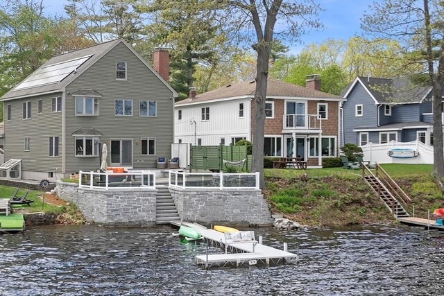 43 W Shore Rd, Merrimac, MA 01860 - rear view of property with stairs, a chimney, and a water view