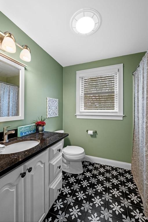 43 W Shore Rd, Merrimac, MA 01860 - full bathroom with vanity, toilet, tile patterned floors, and baseboards