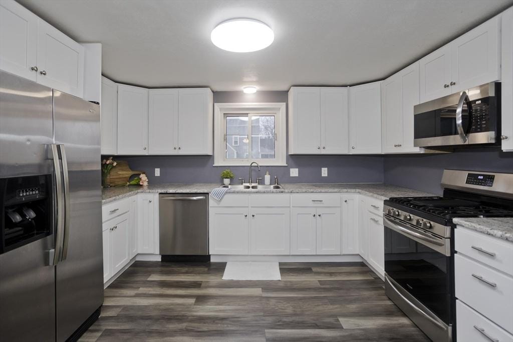 kitchen featuring sink, white cabinetry, and stainless steel appliances