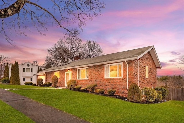 view of front of property with a lawn