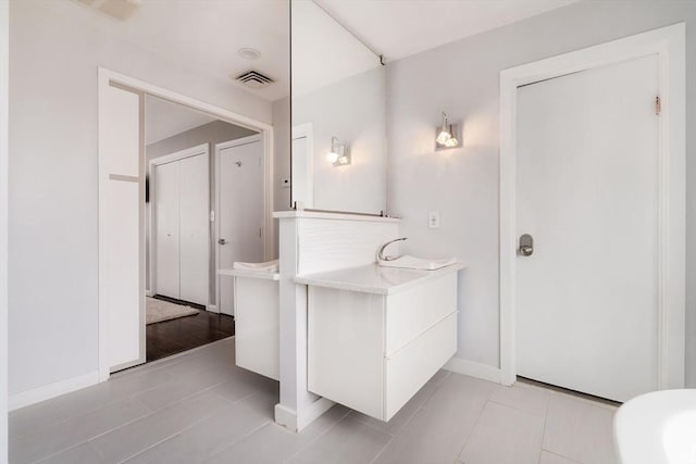 bathroom with sink and tile patterned floors