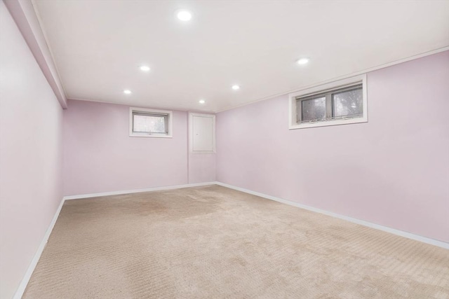 basement featuring light colored carpet