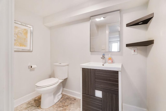 bathroom with toilet and vanity