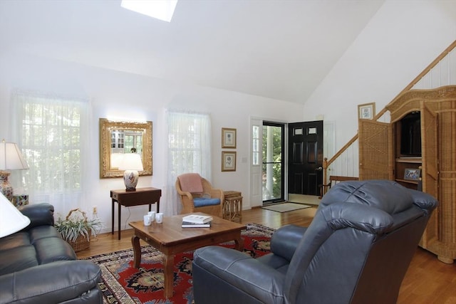 18 Periwinkle Ln, Mashpee, MA 02649 - living room featuring high vaulted ceiling, wood finished floors, and stairs