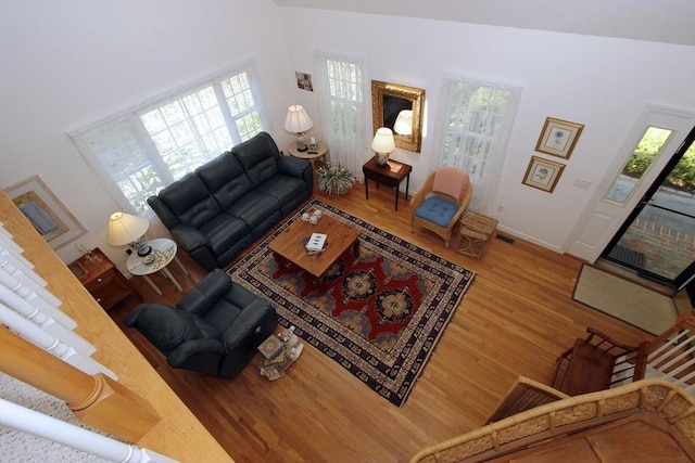 18 Periwinkle Ln, Mashpee, MA 02649 - living area featuring plenty of natural light and wood finished floors