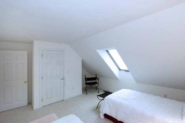18 Periwinkle Ln, Mashpee, MA 02649 - carpeted bedroom with a skylight and lofted ceiling