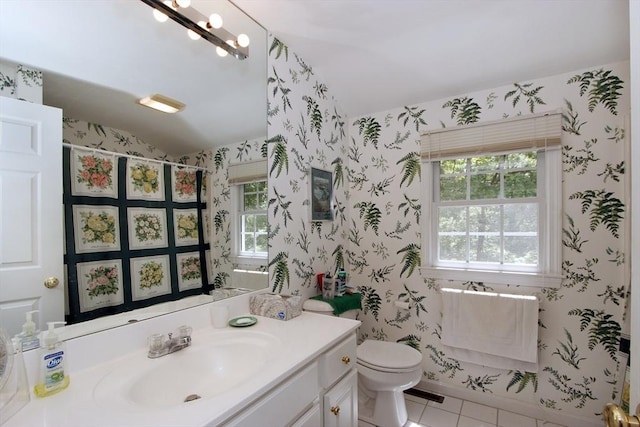 18 Periwinkle Ln, Mashpee, MA 02649 - full bath with vaulted ceiling, vanity, wallpapered walls, healthy amount of natural light, and tile patterned floors
