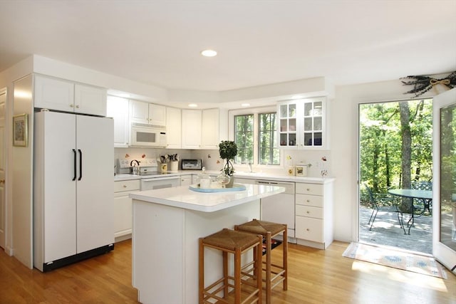 18 Periwinkle Ln, Mashpee, MA 02649 - kitchen featuring white appliances, plenty of natural light, light wood-style floors, and recessed lighting