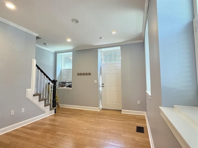 201 Thorndike St Unit 5-01, Lowell, MA 01852 - foyer featuring ornamental molding, light wood-style flooring, stairway, and recessed lighting