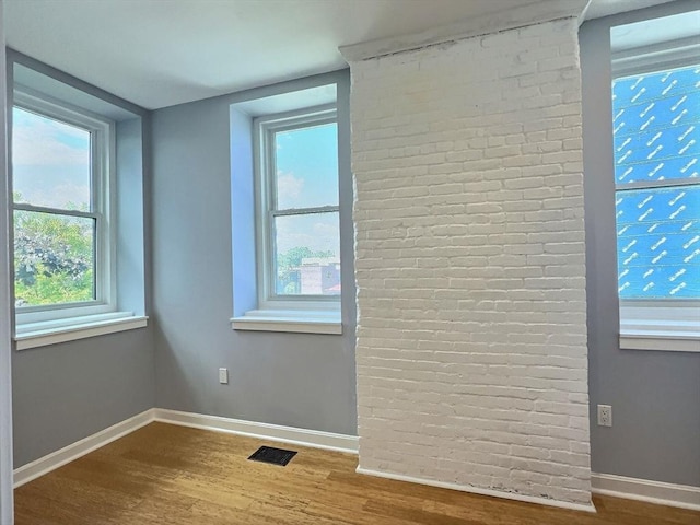 201 Thorndike St Unit 5-01, Lowell, MA 01852 - empty room featuring wood finished floors and plenty of natural light