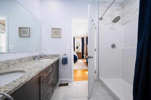 194 Crownshield Ave Unit 194, Uxbridge, MA 01569 - full bathroom featuring marble look tile flooring, a shower with shower curtain, ensuite bath, and double vanity
