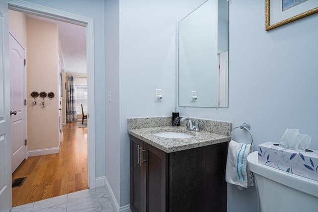 194 Crownshield Ave Unit 194, Uxbridge, MA 01569 - half bathroom featuring vanity and marble finish flooring