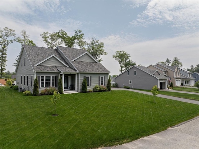 194 Crownshield Ave Unit 194, Uxbridge, MA 01569 - view of front of house featuring a front lawn, roof with shingles, and driveway
