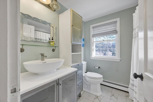 bathroom with baseboard heating, marble finish floor, vanity, and toilet