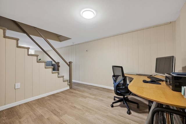 office area featuring baseboards and light wood finished floors