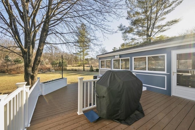 wooden terrace featuring a grill