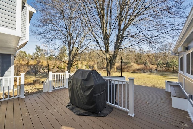 deck with a yard and area for grilling