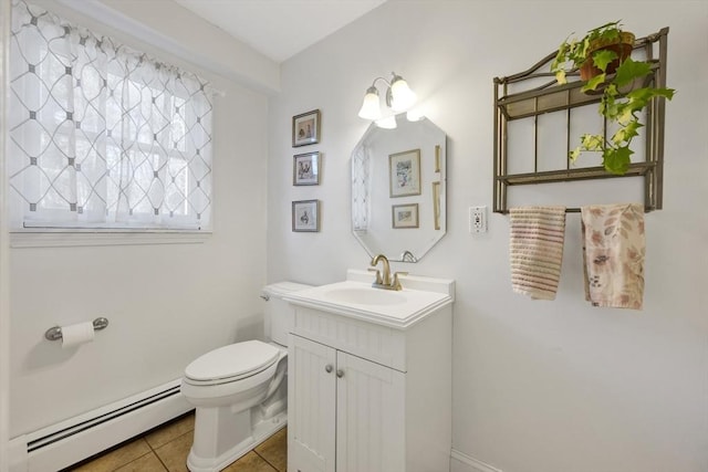 bathroom with a baseboard radiator, toilet, vanity, and tile patterned flooring