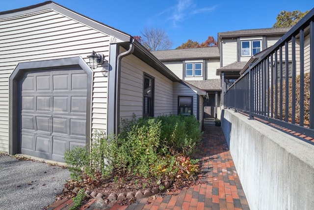 view of side of home with a garage